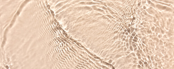 water texture ripples wave clean transparent water abstract background in beige color