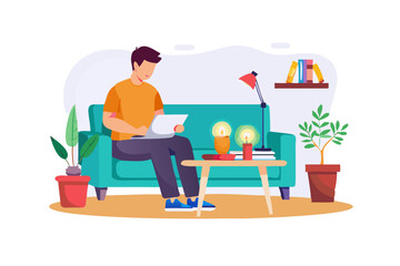 Man relaxing on sofa using laptop at home