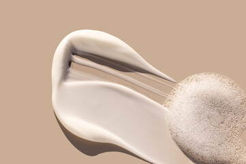Naklejka na ściany i meble creamy texture of cosmetic samples on a pastel beige background