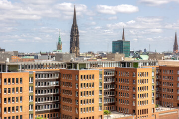 City skyline. Architectural spires. Brick development.