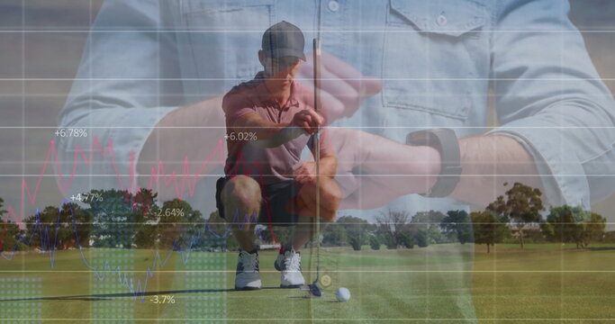 Kneeling golfer in polo cap aligning putter behind golf ball on green, showing smartwatch charts