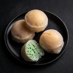 Closeup of Cut Mochi Ice Cream on Black Slate Plate