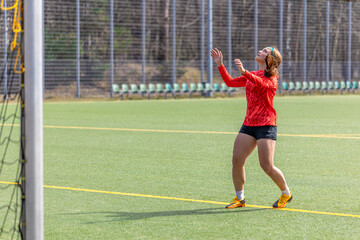 Girl on the soccer field. Soccer training. Active lifestyle. Football concept.