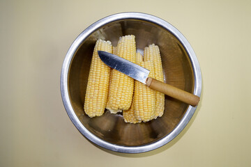 top view of raw corn on a tray
