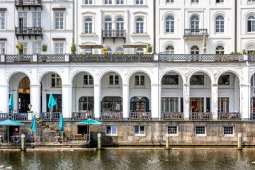 White architecture. Arched terrace. Canal restaurant.