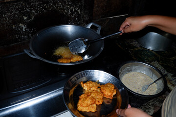 cooking in the kitchen. frying food