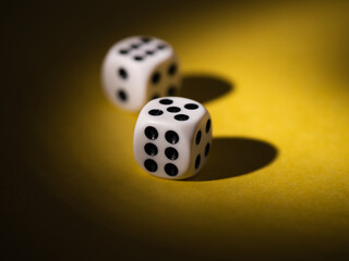 Black and white dice on yellow background