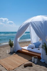 Tranquil beach oasis with canopy bed overlooking ocean waves on sunny day