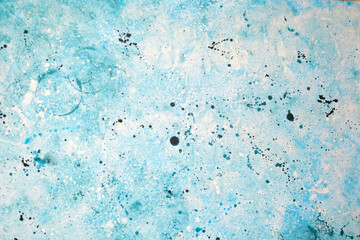 Unique abstract artwork featuring blue and white splashes of paint