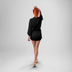 Mockup of a black silk kimono with a belt on a red-haired girl with a tattoo, back view, isolated on a background.