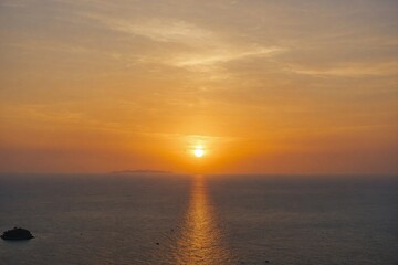 Beautiful sunset on Andaman sea at Windmill View Point near Laem Promthep Cape, Phuket, Thailand
