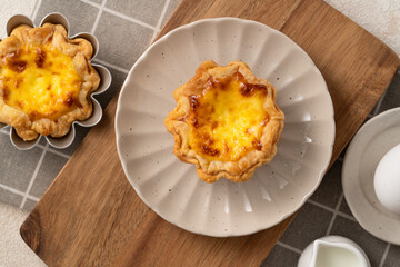 Delicious puff pastry Portuguese egg tart Pastel de nata in flower shape.