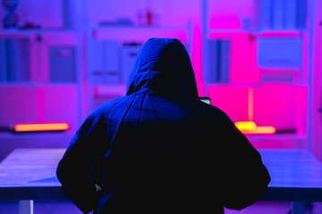 Mysterious Figure in Hoodie Engaged in Cybersecurity Activities