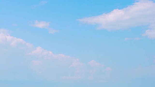 White Transforming Cumulus Clouds Light Blue Sky On A Clear Sunny Day Time Lapse. Cloudiness. Good Weather. White Clouds and Azure Sky Timelapse, Skyscrapers, Firmament, Heaven, Atmosphere.