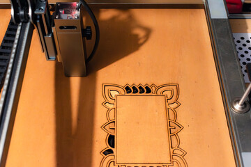 Laser engraving and cutting, using reclaimed wood, upcycling concept