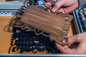 Laser engraving and cutting, using reclaimed wood, upcycling concept