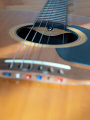 closeup of an acoustic guitar with details
