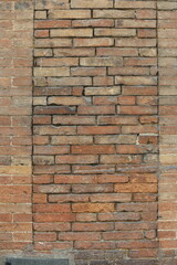 close up of brick wall texture of and historic building in Siena, Italy
