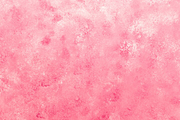 Pink plaster wall with mottled soft texture and subtle light effect