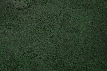 Dark green textured wall with aged rough plaster and grunge pattern