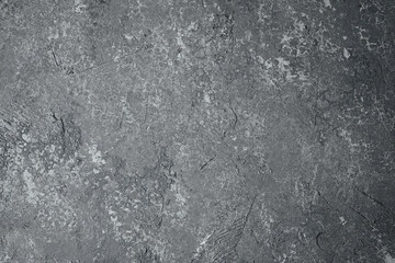 Dark gray wall with grunge texture and detailed plaster surface