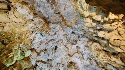 Majestic rock formations inside Thien Cung Cave, a popular attraction in Ha Long Bay, Vietnam.