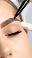 Naklejka premium Brow Shaping and Tinting Beauty Treatment Close Up.