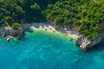 Secluded beach with colorful kayaks on the Istria Peninsula, Croatia