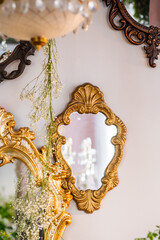 Elegant vintage mirrors adorned with delicate flowers in a cozy room setting