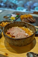 Delicious Asian Pork Noodle Soup in a Rustic Bowl A Culinary Delight