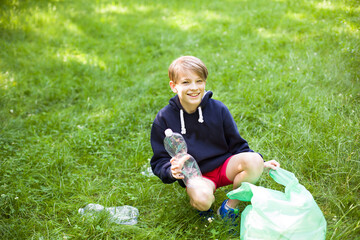 Child Collecting Plastic Waste in Nature