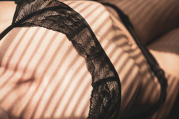 Woman in lingerie for sexual role model concept. Selective focus on bra, blurred background.
