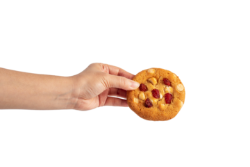 Vanilla cookies topped with nuts and strawberries and hand on a transparent background
