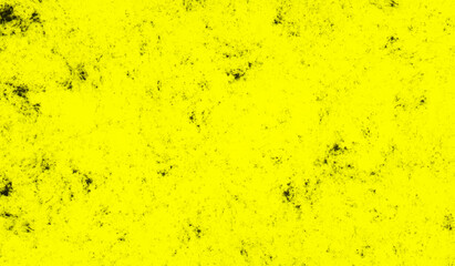 Scattered grunge texture yellow color cement plaster wall surface. Dark grunge texture on bright yellow concrete wall.