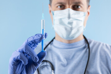 Doctor in gloves hold syringe with medication, closeup. Vaccination and immunization