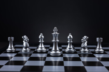 white chess pieces arranged on a chessboard, creating a visually appealing and strategic composition
