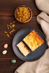 Сottage cheese Сasserole, Curd cake, with dried apricots and raisins on brown wooden, top view, close up