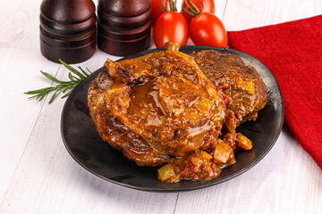 Italian cuisine - ossobuco with sauce