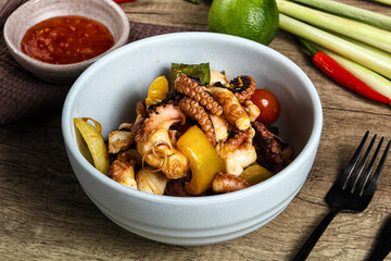 Roasted octopus with vegetables and oil