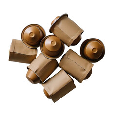 A scattered arrangement of brown coffee capsules partially wrapped in paper on a black background
