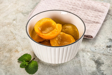 Canned marinated peach in syrop