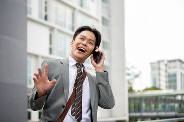 Laughing businessman or sale agent phone calling with customer while discussing on land and building