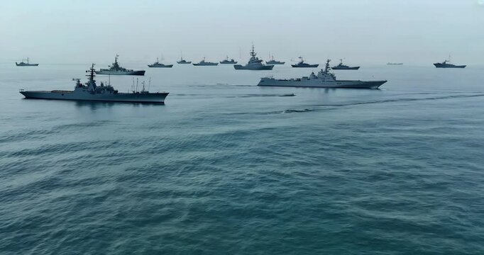Aerial view of military warships in calm water near Hormuz Strait