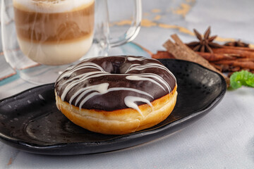 Delicous sweet donut with chocolate glaze