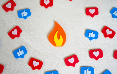 Flame figurine trending among social media likes. Viral event, memes and news. Digital trends, or online controversy. Content going viral, attention economy, or the firestorm of public opinion.