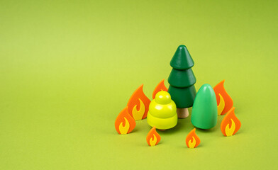 Forest on fire, metaphor from figurines. Preservation of forest and fauna, preventive measures and...