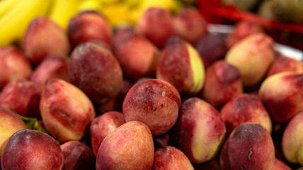Freshly picked ripe peaches that come in bright and vibrant colors perfect for summertime enjoyment and desserts