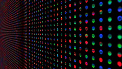 Obraz premium LED, RGB, pixels, display — ultra-closeup image reveals hundreds of luminous dots forming a vibrant, colorful matrix. Perfect geometric spacing and studio lighting highlight macro textures of modern d