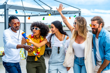 Friends singing karaoke at rooftop party having fun
