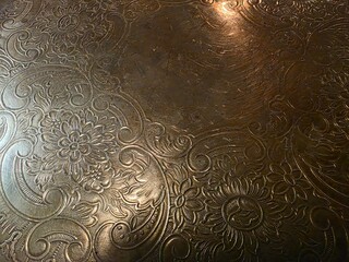 Ancient embossed copper plate detail